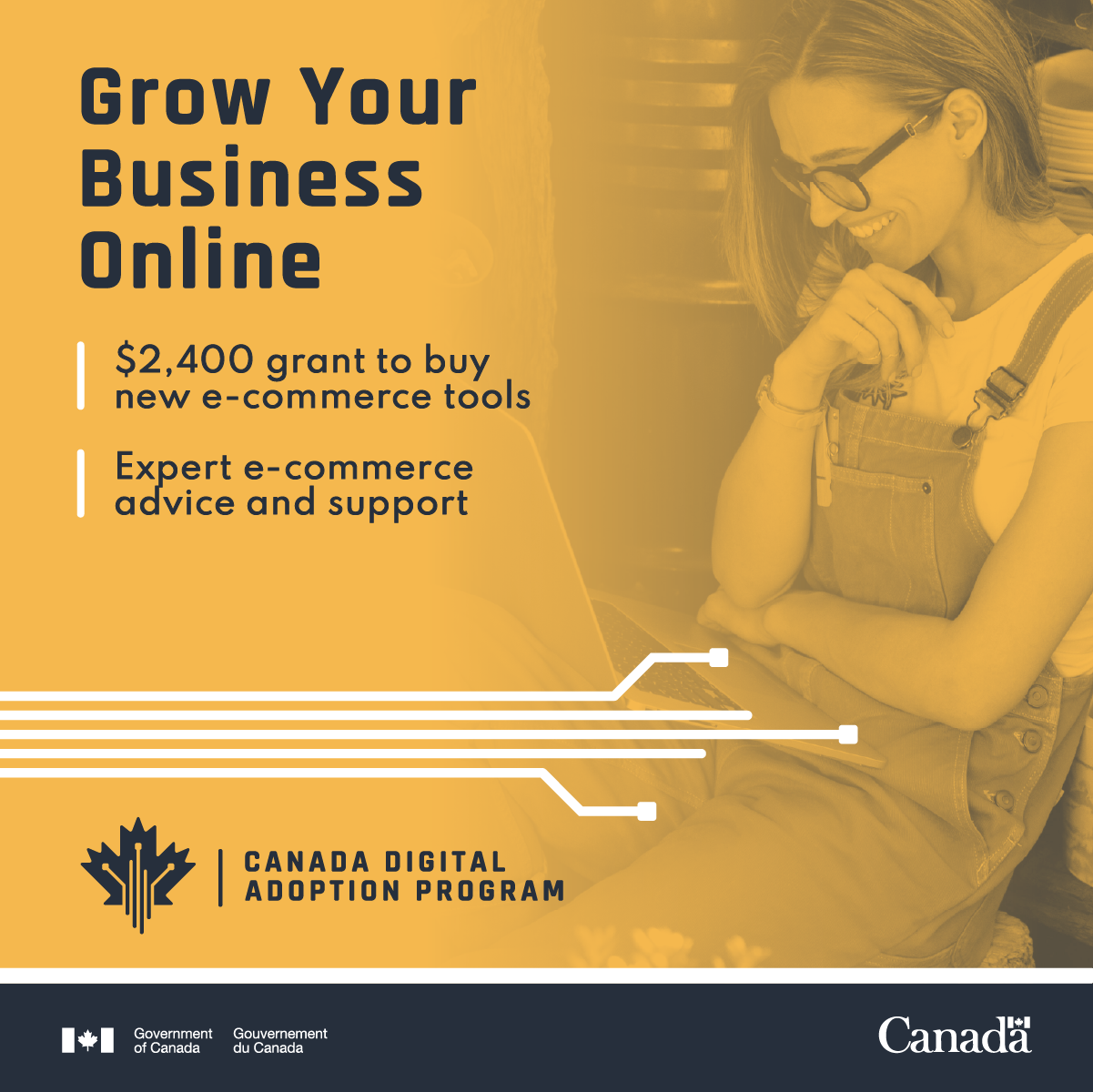 Woman wearing glasses and overalls smiles while looking at her laptop. With text: Grow Your Business Online; $2400 grant to buy new e-commerce tools; expert e-commerce advice and support; Canada Digital Adoption Program. 