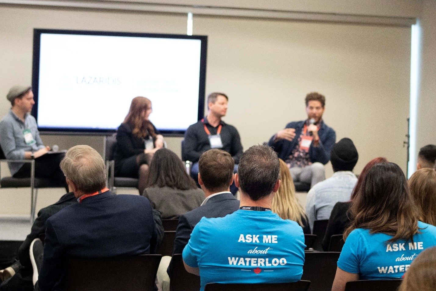 Members of the Waterloo EDC team look on as Waterloo Region business leaders participate in a panel discussion on scaling a tech company at the Collision Conference in May 2019. Waterloo EDC planned and co-ordinated the panel with the Lazaridis Institute.