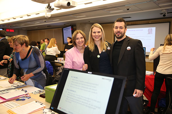 Photo showing three ISED employees promoting the department's healthy workplace services at a government-wide event