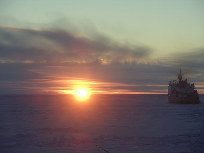 United States Coast Guard Cutter Healy in the sunset. Photo credit: David Mosher