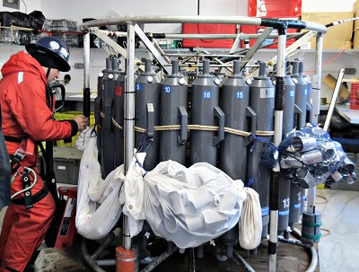Glenn Cooper retrieving the CTD rosette after casting in the oceanography lab